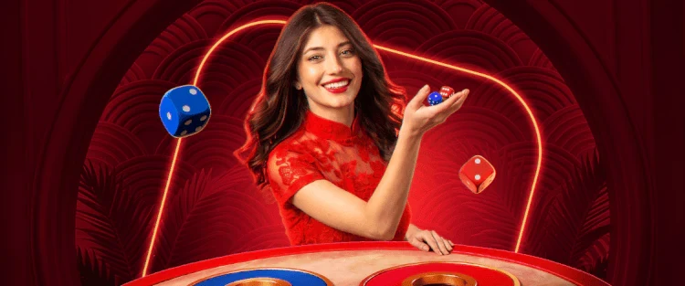 A croupier rolling dice across a red table